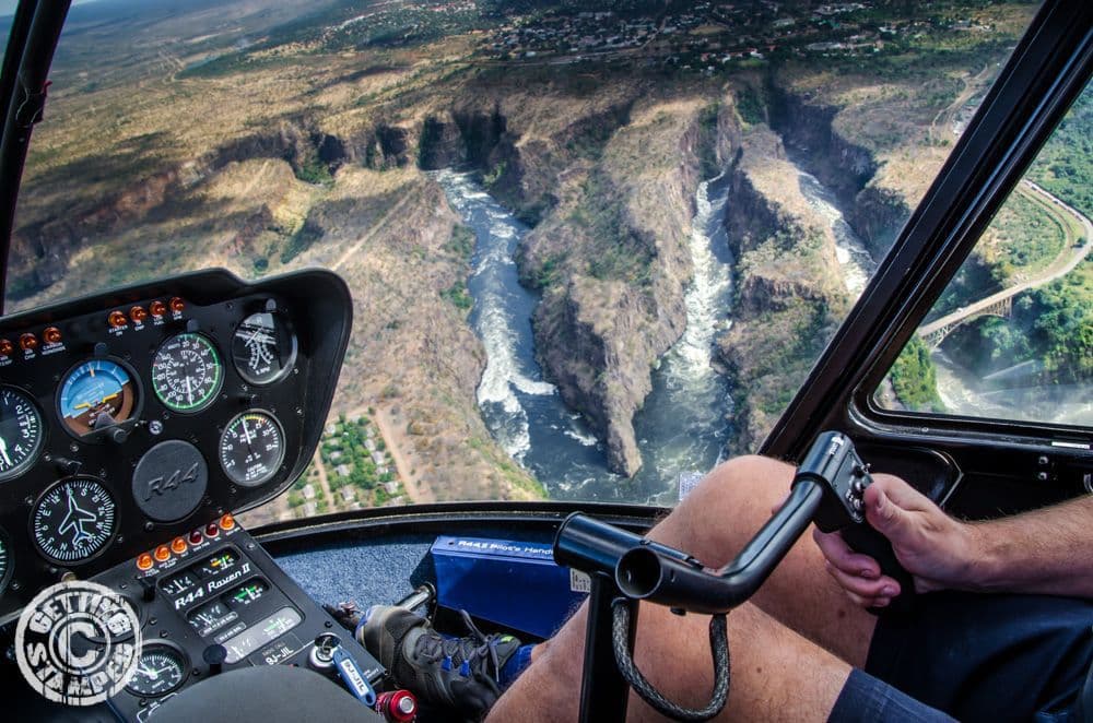 Helicopter cockpit view over the Victoria Falls gorge.