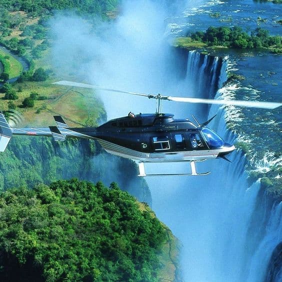 Helicopter flying above Victoria Falls and the gorge.