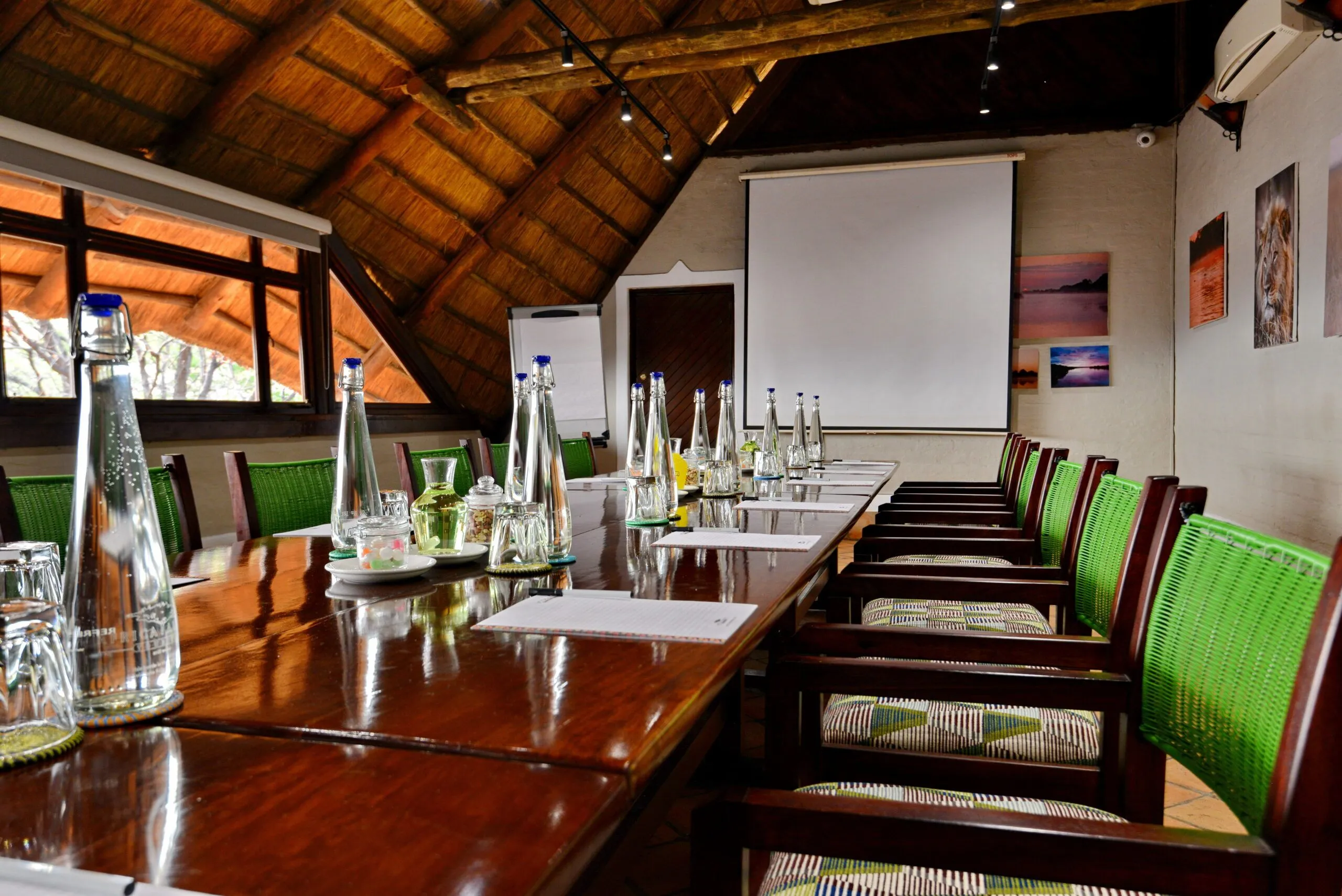 Thatched safari executive boardroom — destination-led meeting space.